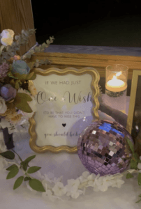 Gold frame with loving words about those not present displayed on a memorial table at All4One Farms in Jacksonville, FL